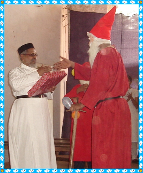 X mas Gift presented to Fr. O P Varghese by Xmas Father